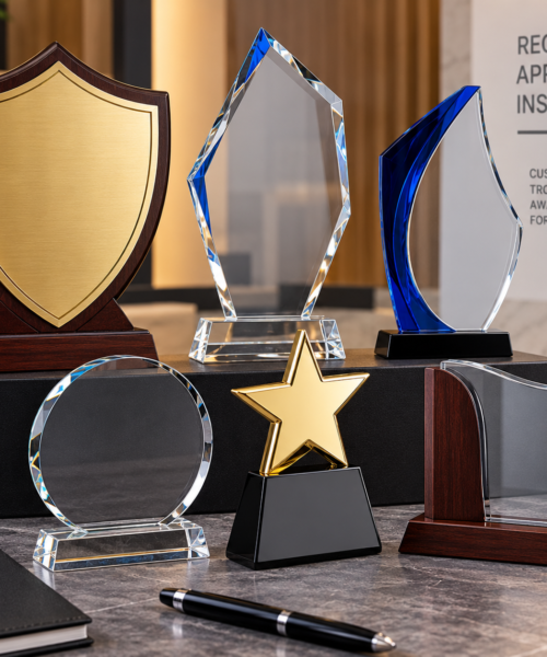 Custom shields and awards by Fabrica Printing featuring premium wooden shields, crystal awards, acrylic trophies and personalized recognition awards for corporate, academic and sports events.